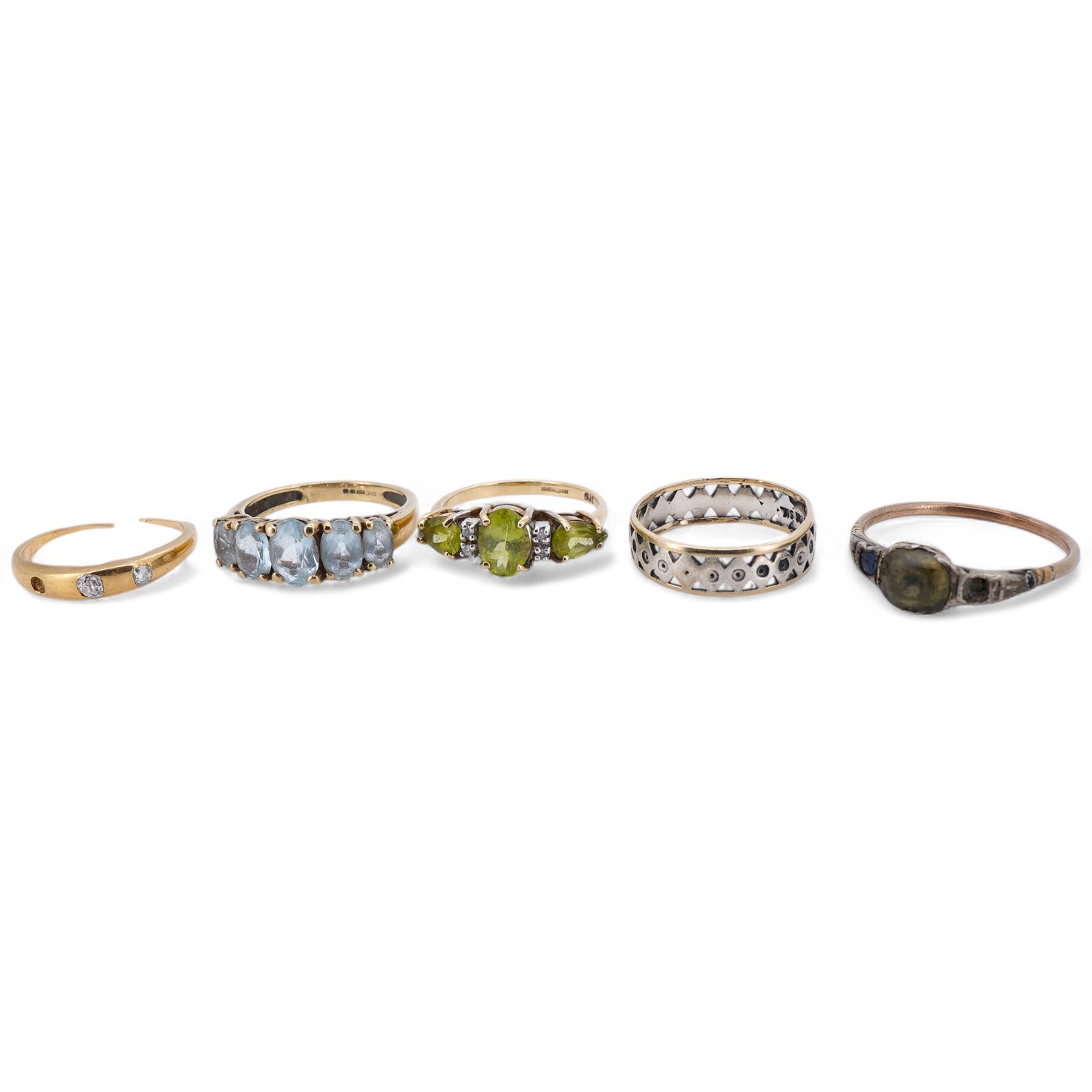 Five rings, comprising: a peridot and diamond ring and a blue topaz ring, each mounted in 9ct gold, sizes J and K1/2; gross weight approximately 3.5 grams; a gold ring set with cushion-shaped diamonds, shank broken, one